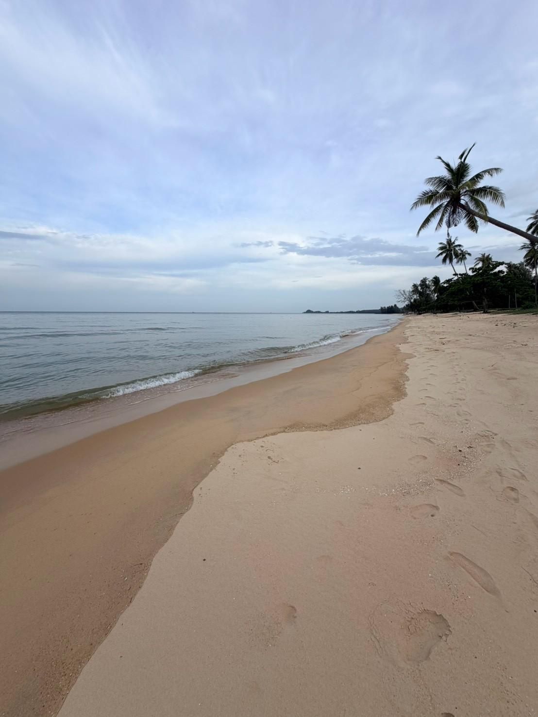 Sichon Beach site: Beach with footprints toward headland