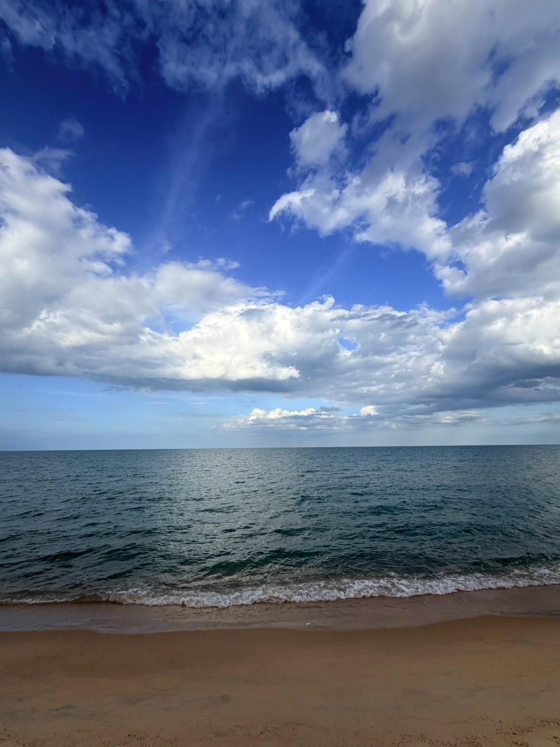 Sichon Beach site: Cumulus sky over sea and beach
