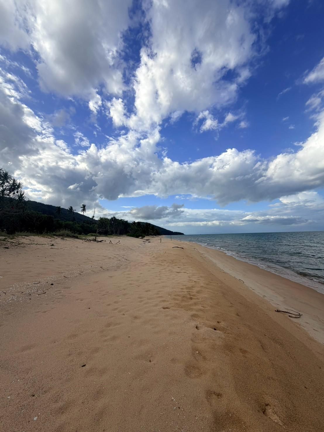 Sichon Beach site: Curving beach under cumulus sky