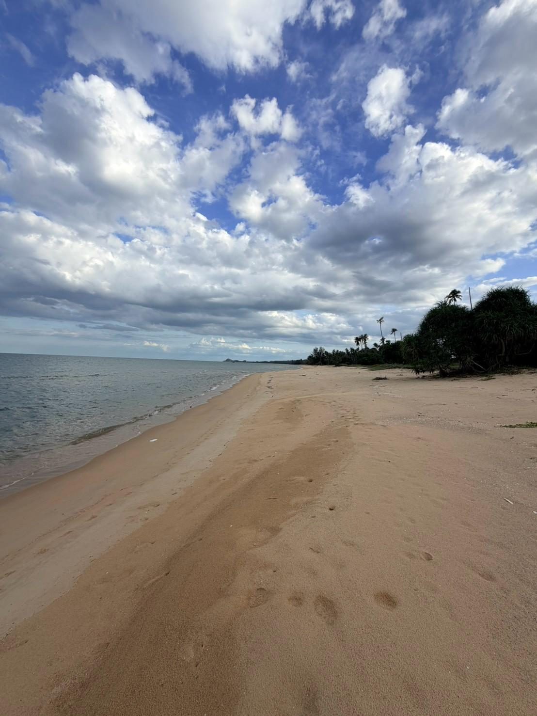 Curving beach and headland at Sichon